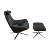Black leather armchair with footrest