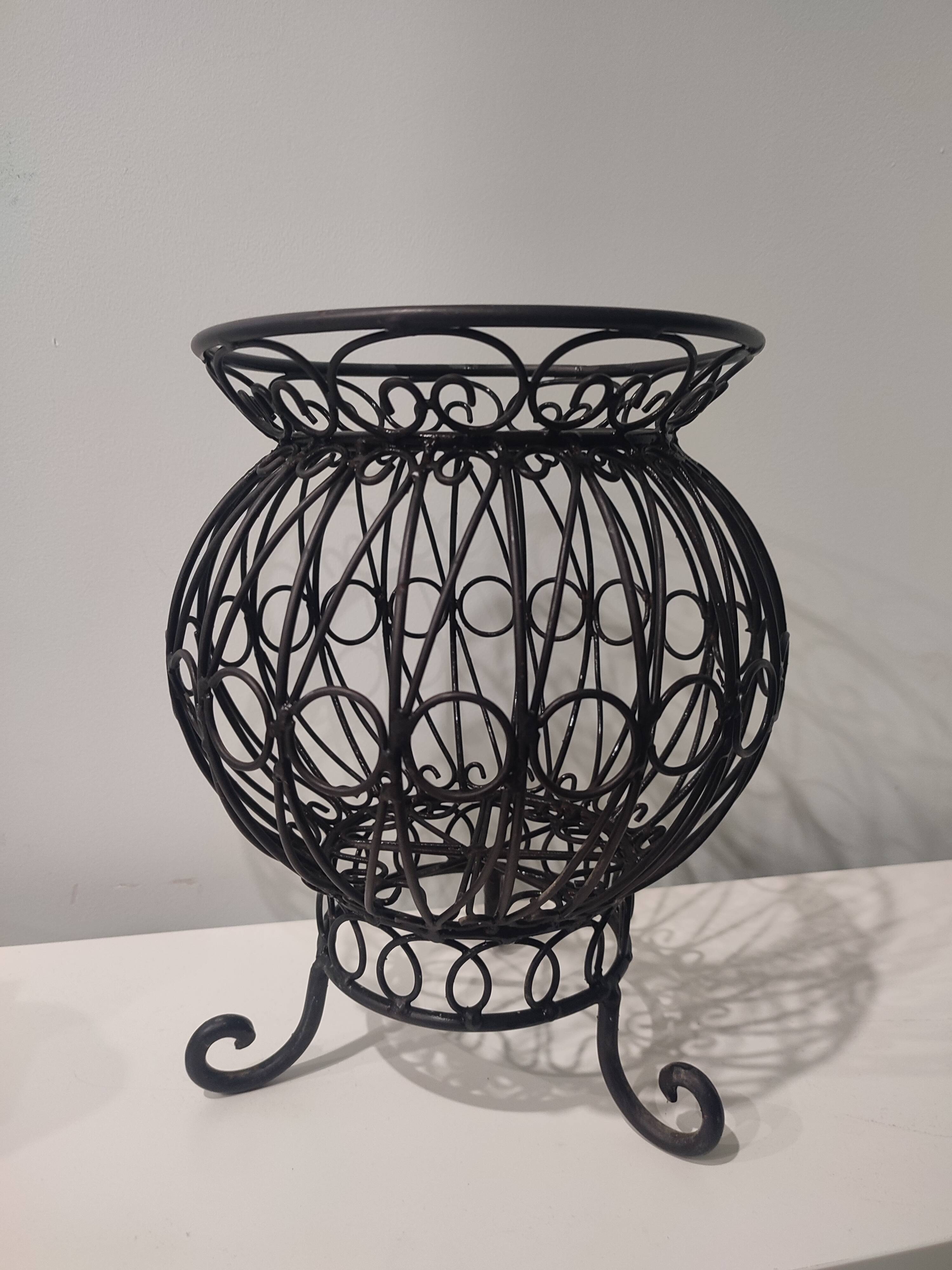 Old black iron vase
