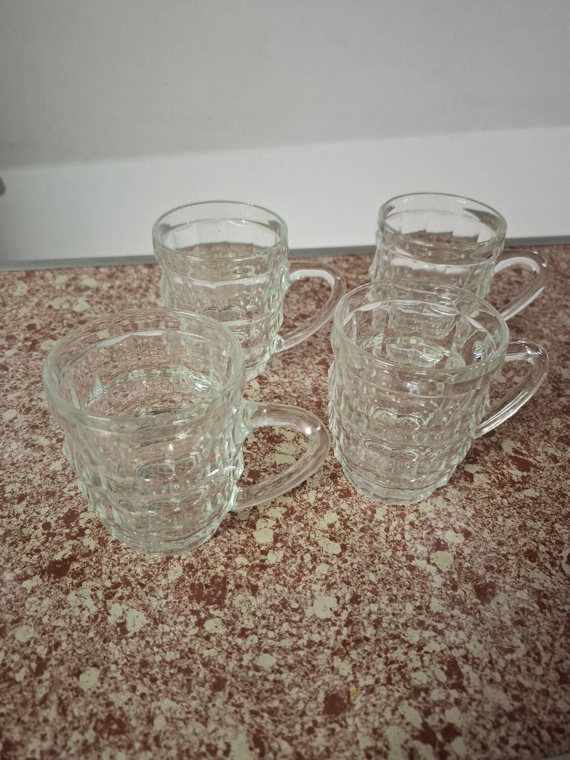 Set of four glass mugs