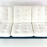 Three-seater sofa, removable cushions reupholstered in white teddy, circa 1970