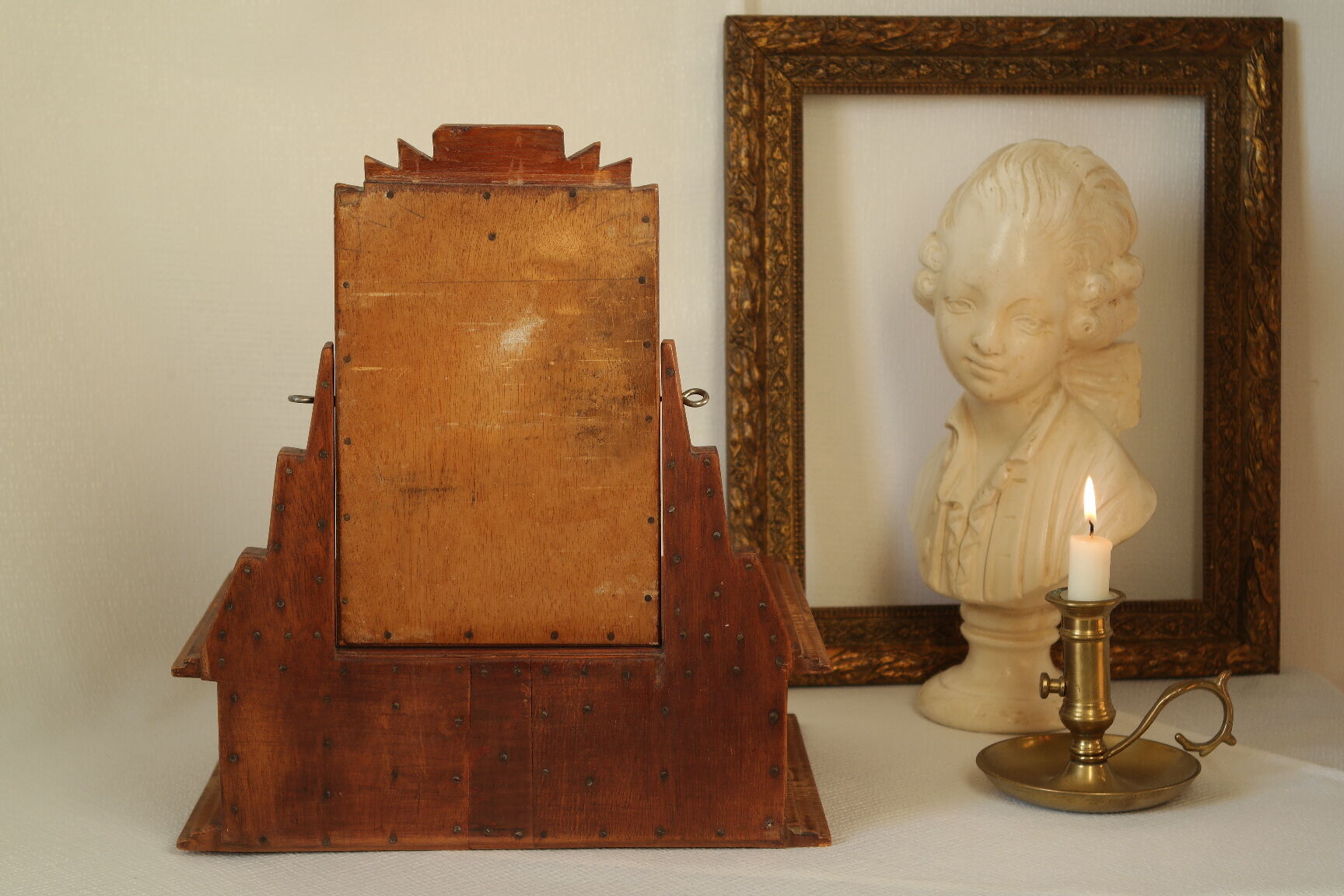 Antique wooden table mirror in Art Deco style.
