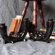 2 black ceramic candle holders
