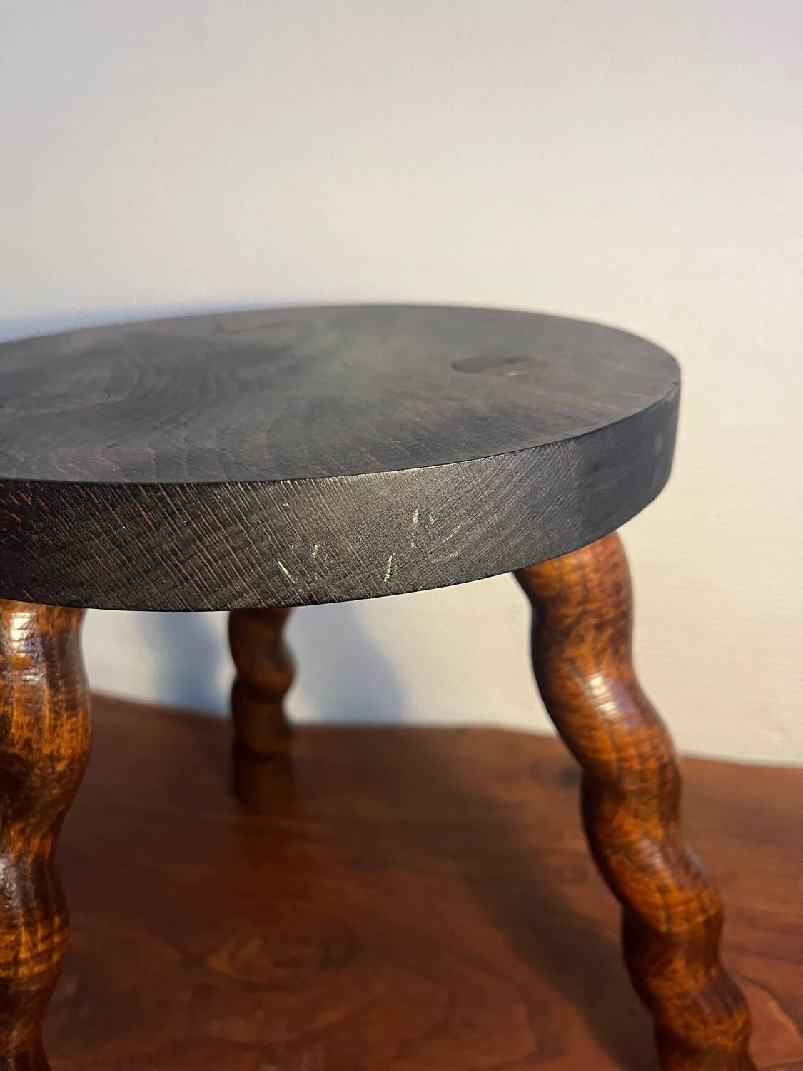 Round tripod stool with turned wooden legs