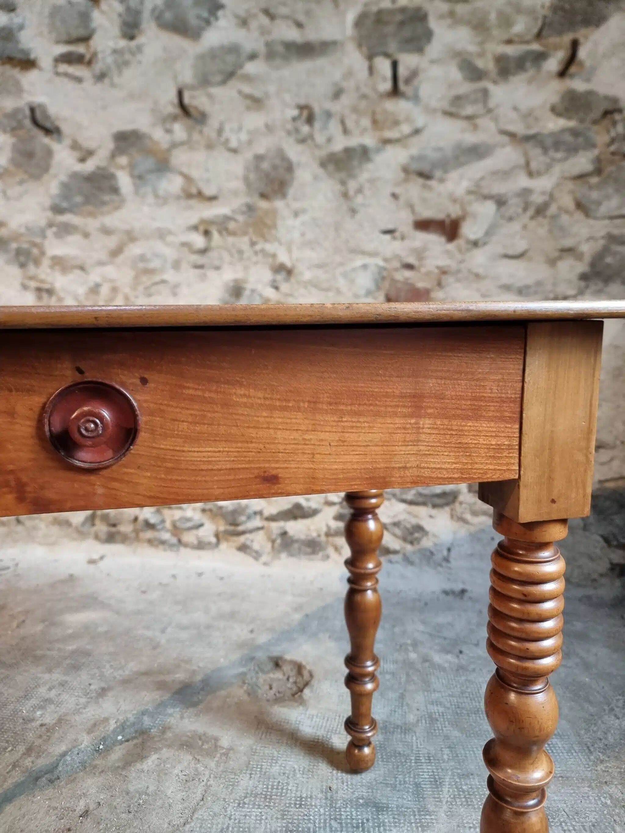 Small antique French writing table in walnut with a drawer, around 1900.