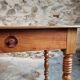 Small antique French writing table in walnut with a drawer, around 1900.