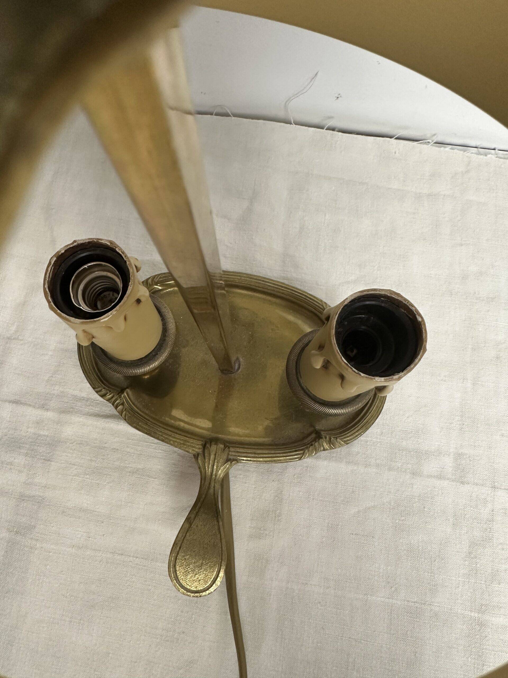 A pair of old brass bed warmers.