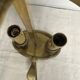 A pair of old brass bed warmers.