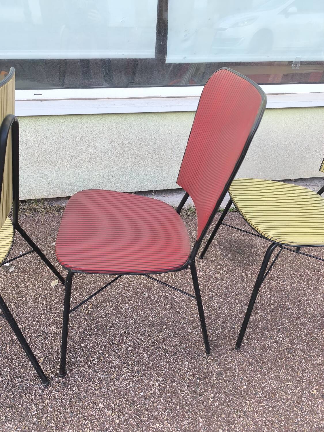 Set of 3 vintage yellow and red faux leather chairs.