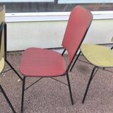 Set of 3 vintage yellow and red faux leather chairs.