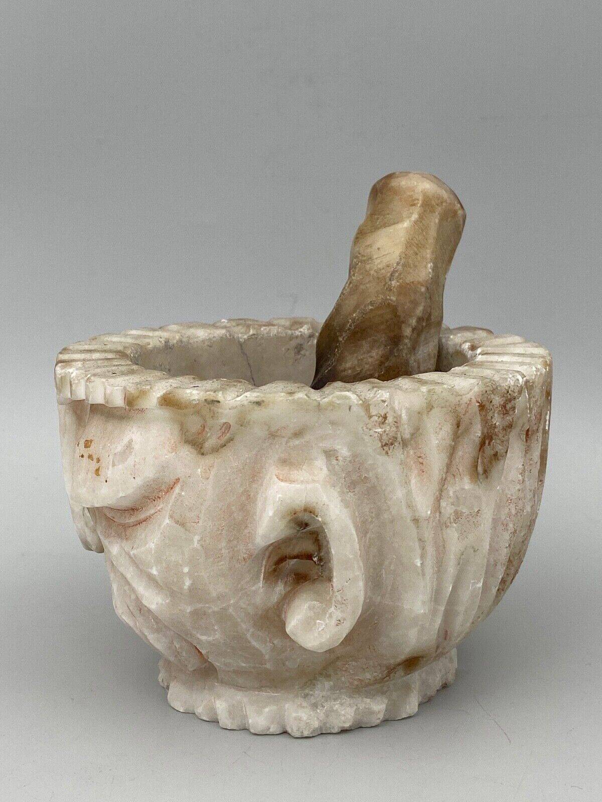 Pharmacy mortar and pestle in alabaster China man's face