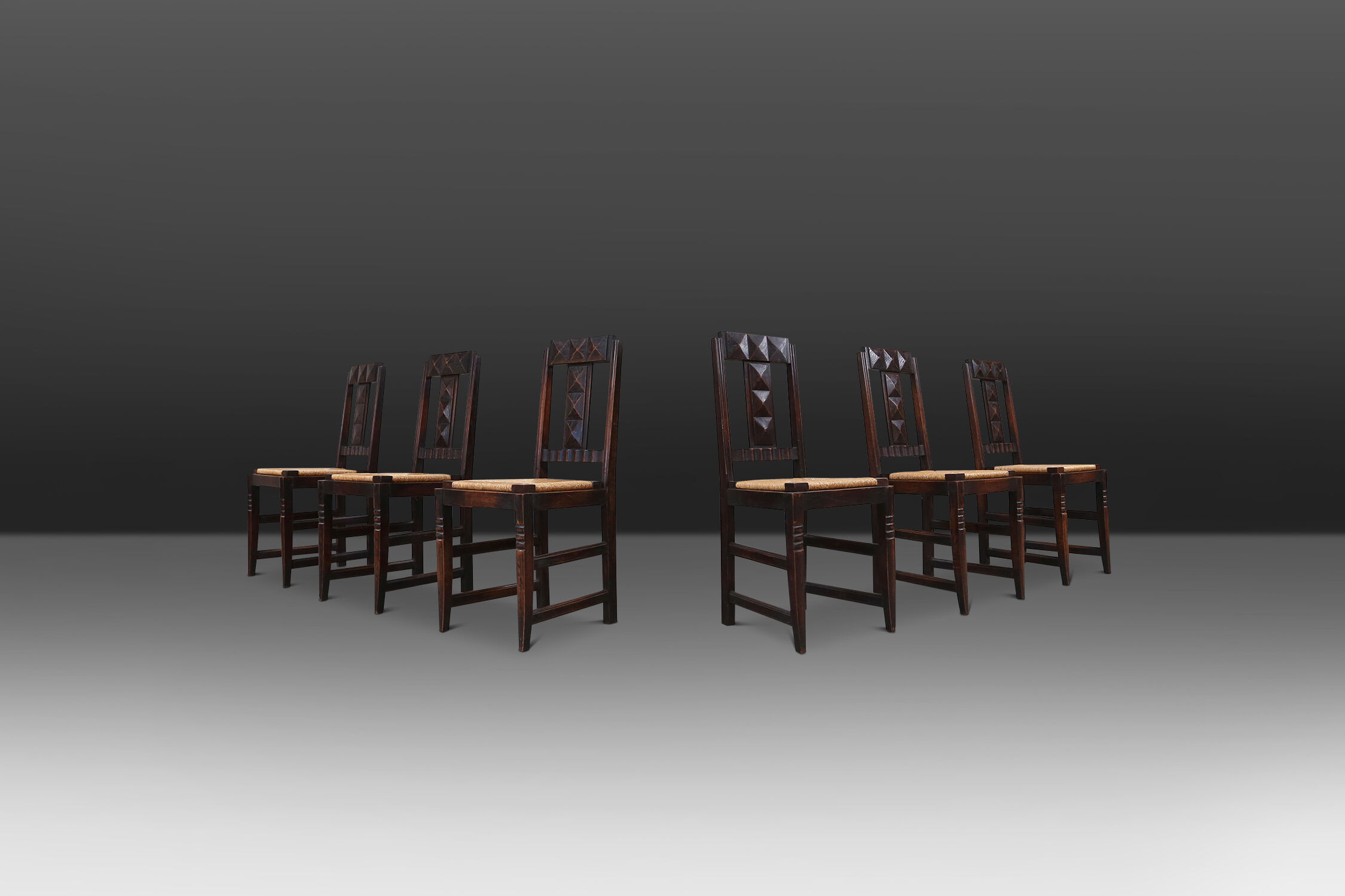 Set of six oak an wicker dining chairs by Victor Courtray