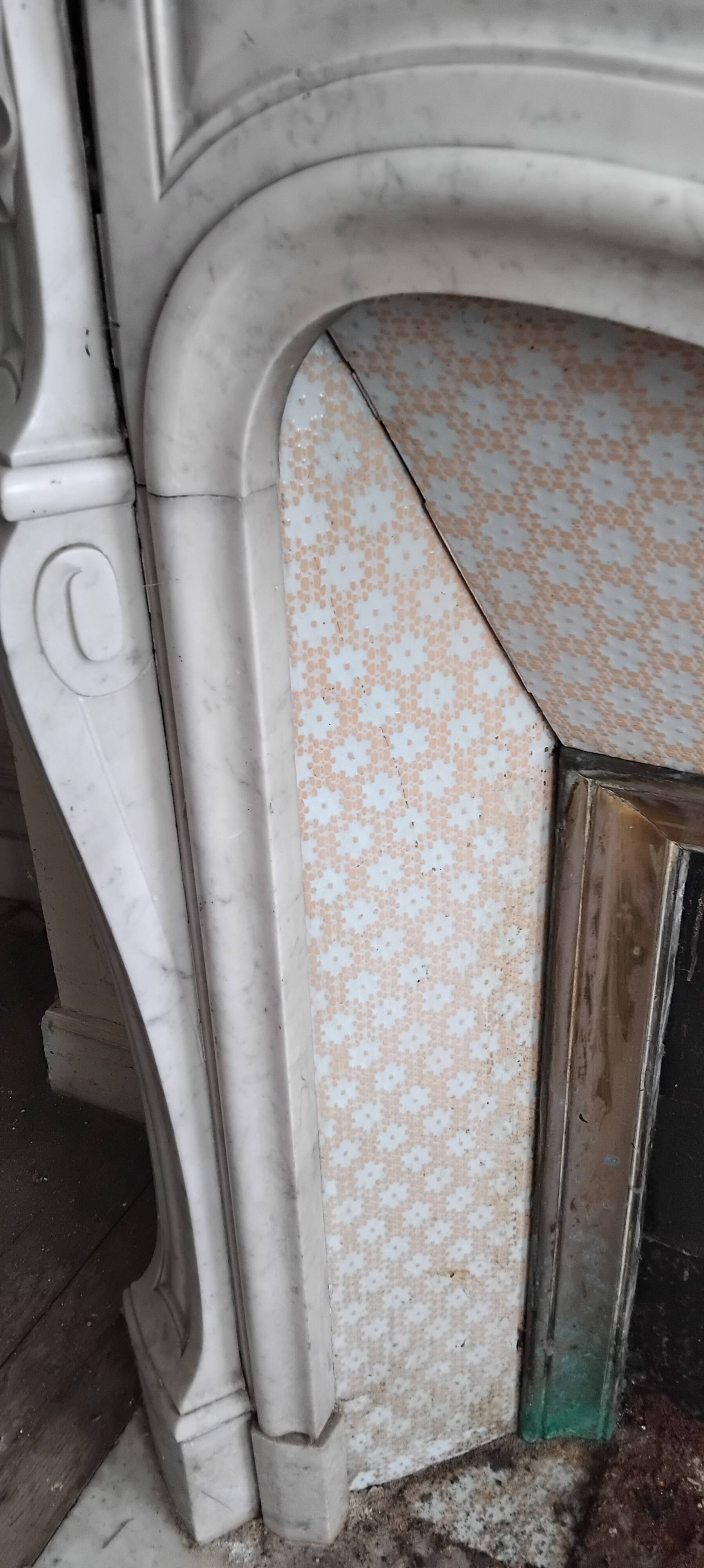Louis XV style fireplace in veined white Carrara marble and XI ceramics.