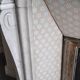 Louis XV style fireplace in veined white Carrara marble and XI ceramics.