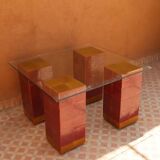 Modern coffee table in burgundy zellige with a tempered glass top.