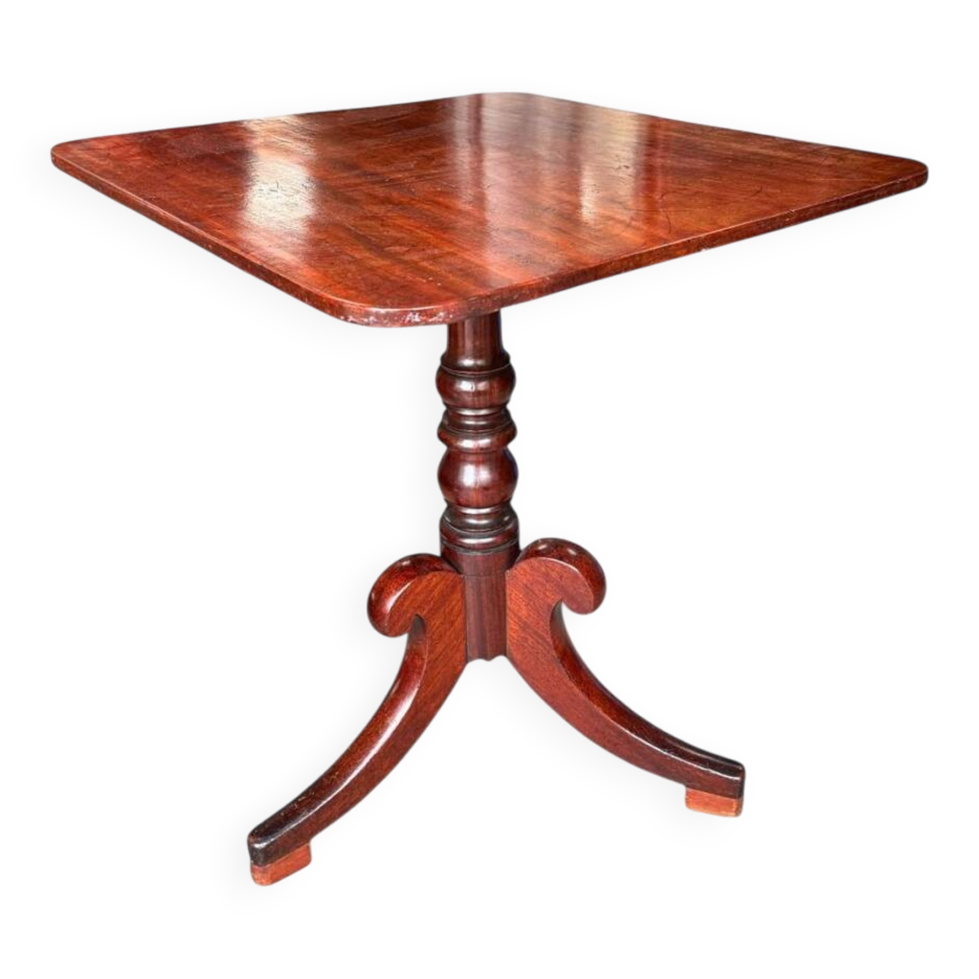 19th-century solid mahogany tilting table with a brass mechanism.