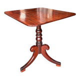 19th-century solid mahogany tilting table with a brass mechanism.