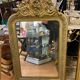 LARGE LOUIS XV STYLE ROCAILLE MIRROR IN GILT STUCCO FORAL DECOR ON PEDAL