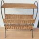 Antique magazine rack made of iron and woven rattan wicker