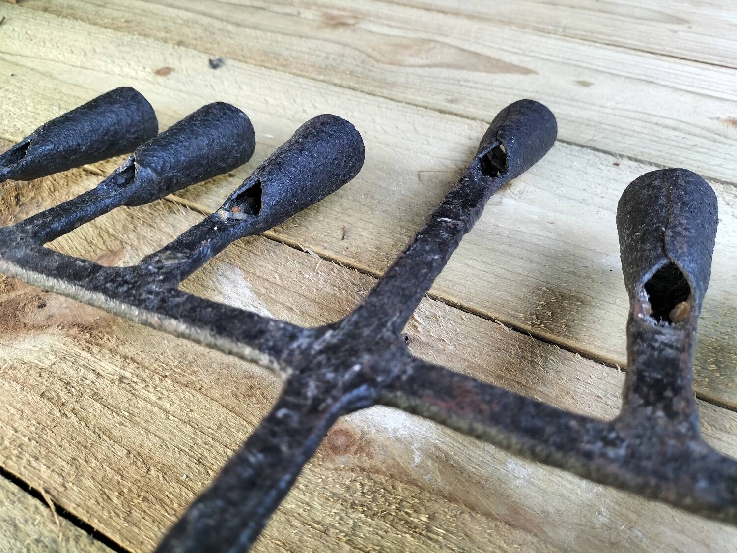 Brutalized wrought iron candle holder