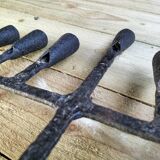 Brutalized wrought iron candle holder