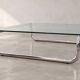 Coffee table in chrome with a glass top.