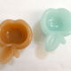 Pair of Apple opalin ashtrays
