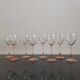 4 Luminarc white wine glasses with pink feet