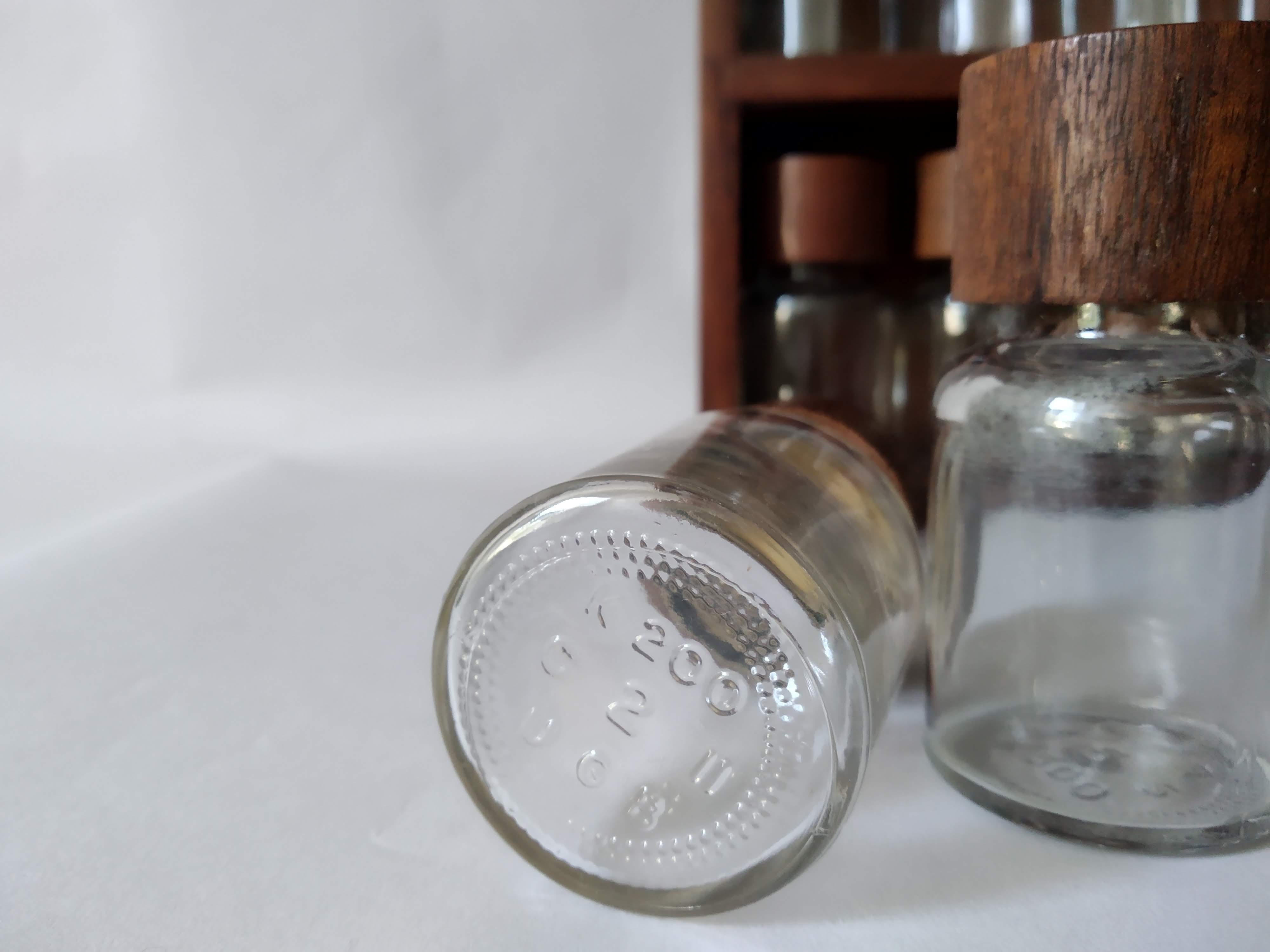 Wooden shelf with 32 vintage Cole & Mason spice jars