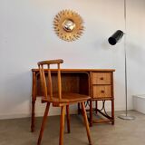 Old large golden sun mirror with rounded witch's eye in vintage resin from the 70s