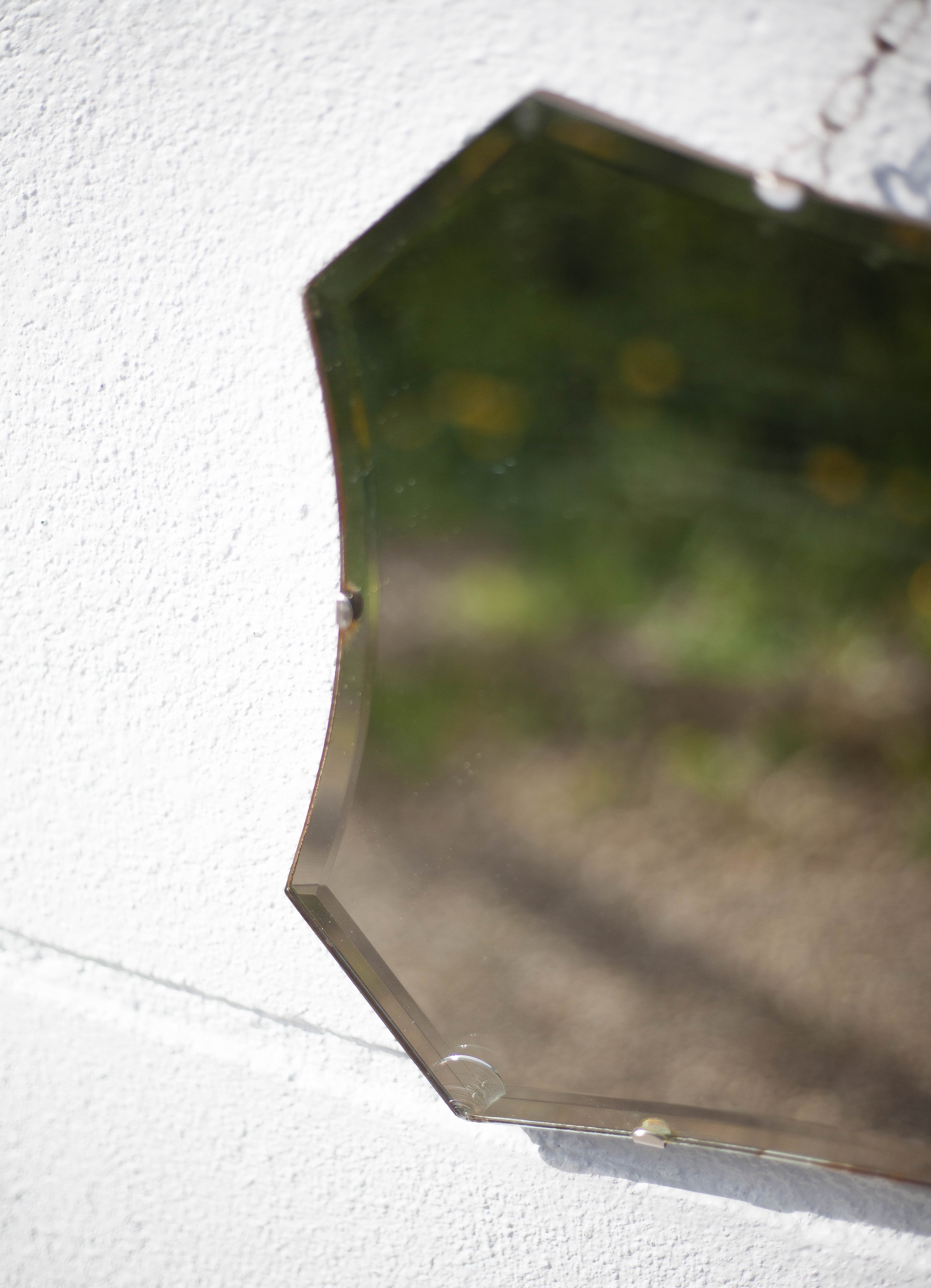 Vintage wall mirror with beveled chain