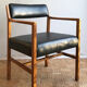 Chair in light teak and black skaï from the 1960s