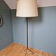 Vintage tripod floor lamp in black lacquered metal and brass, 50s