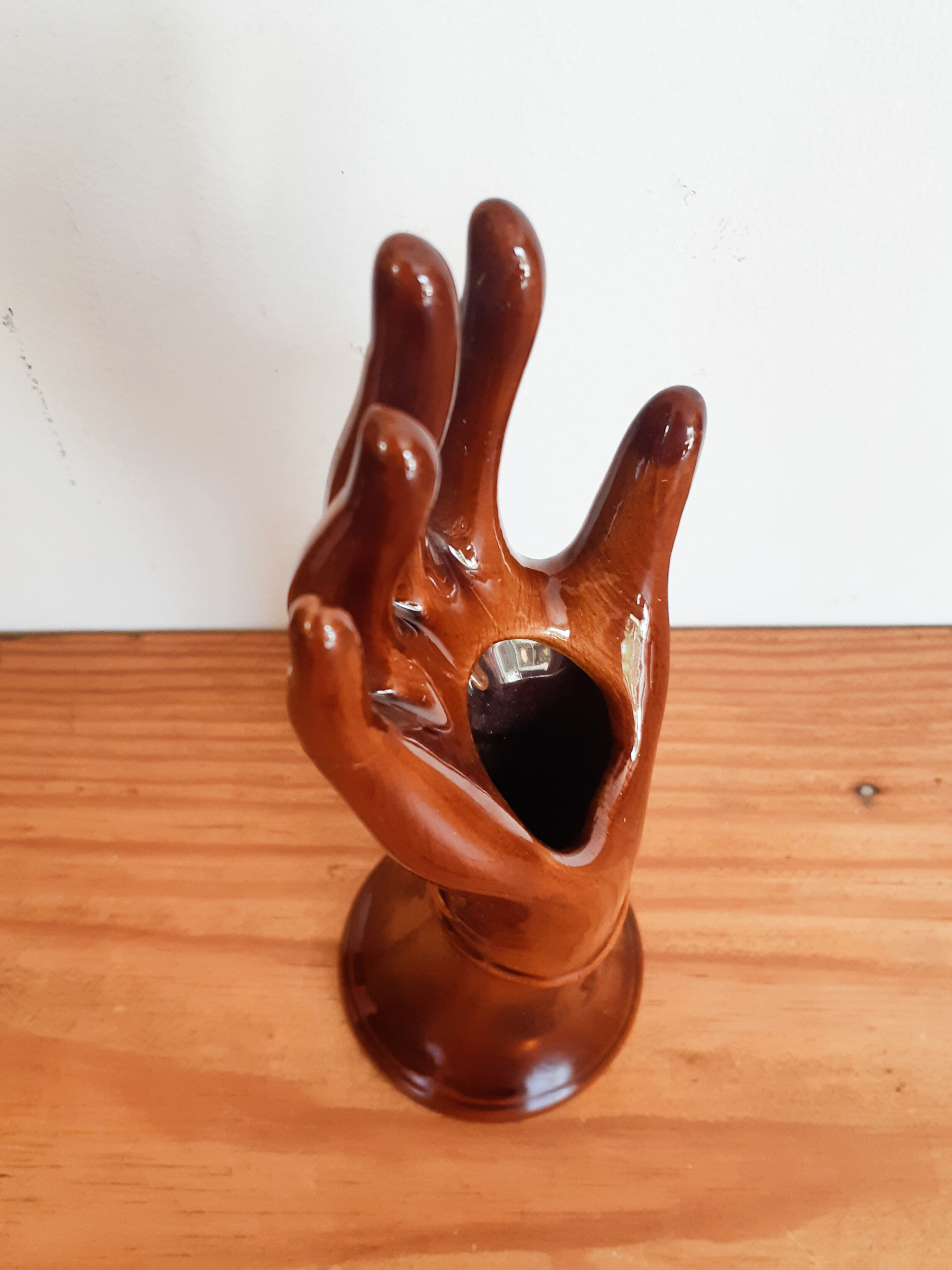 Hand wears brown jewelry , ring, soliflore , vintage French , 50s