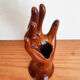 Hand wears brown jewelry , ring, soliflore , vintage French , 50s