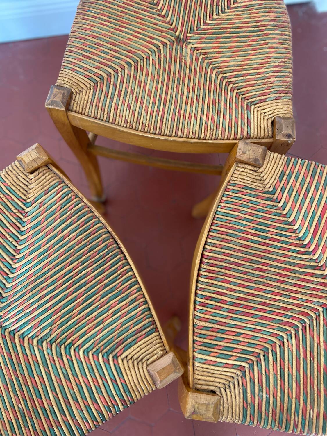 Trio of vintage straw/colored chairs