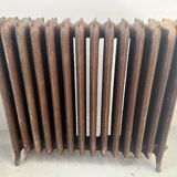 Ancien radiateur sur pied a quatorze lames fleuries en fonte de fer XX sièc