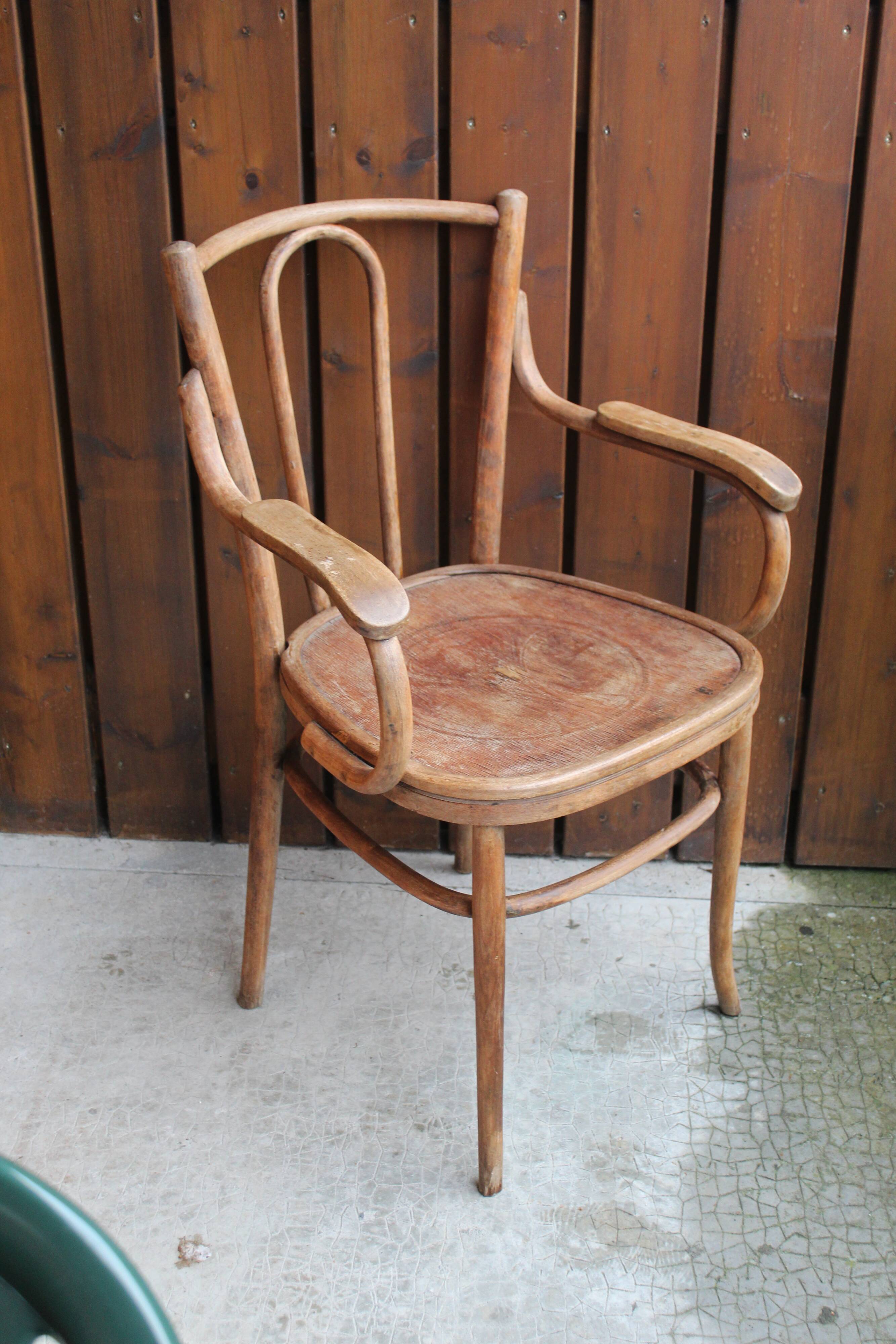 Curved wooden armchair