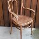 Curved wooden armchair