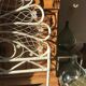 Rattan headboard & white wicker peacock tail décor 50-60s