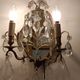 Pair of mirror sconces with two arms of light with gilded brass grapevines, Italy 1960.