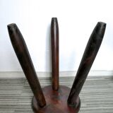 Dark wooden tripod stool