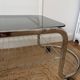 Table basse en métal et verre fumé 1970