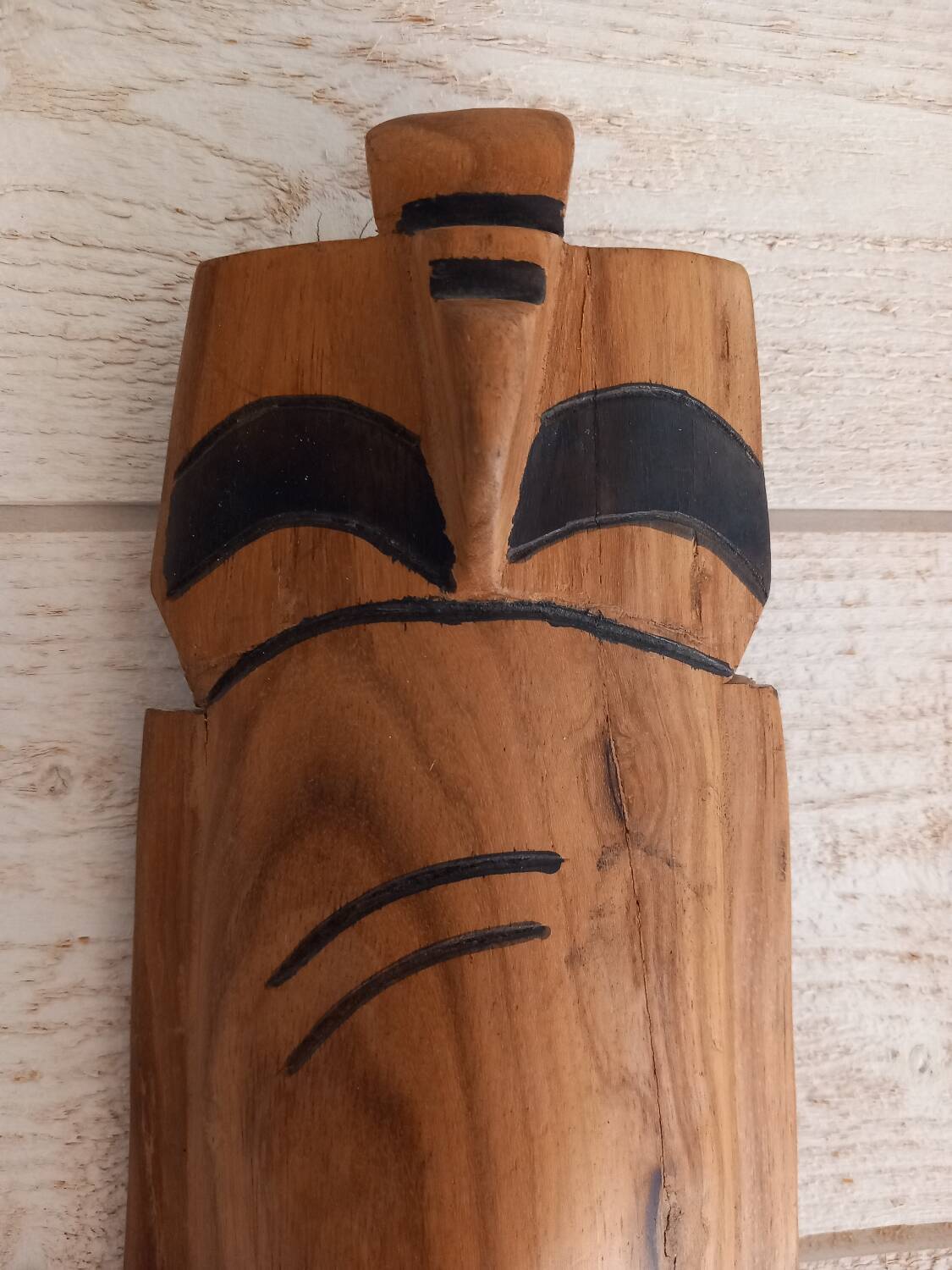 African mask in light wood
