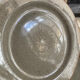 Four beige speckled plates