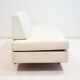 Italian modernist daybed with white upholstery and iron frame.