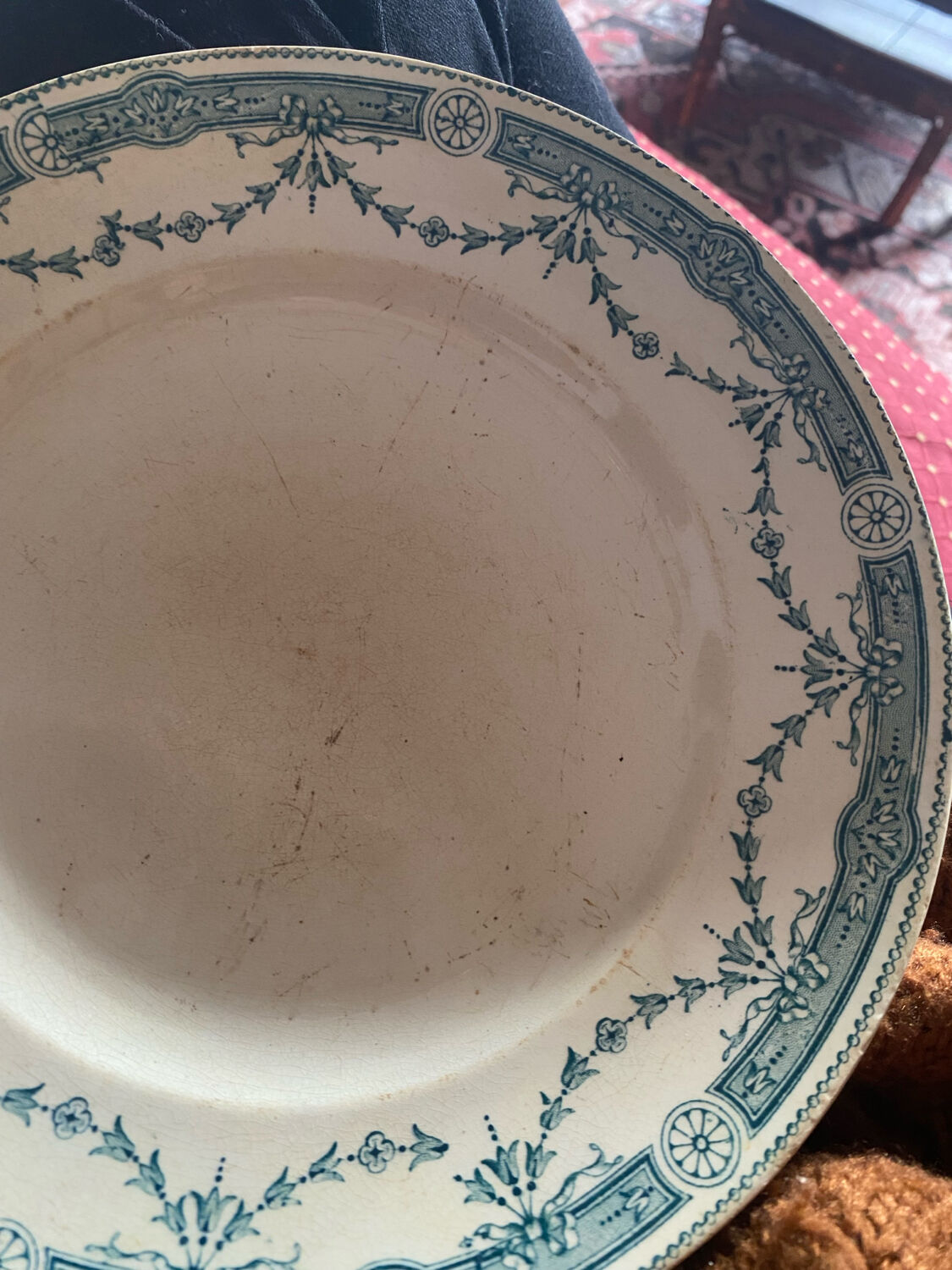 3 flat plates in ironstone with a floral green border.