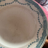 3 flat plates in ironstone with a floral green border.