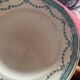 3 flat plates in ironstone with a floral green border.