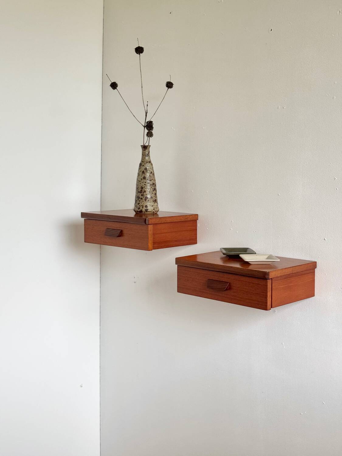Vintage Scandinavian teak wall-mounted bedside tables.