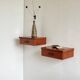 Vintage Scandinavian teak wall-mounted bedside tables.
